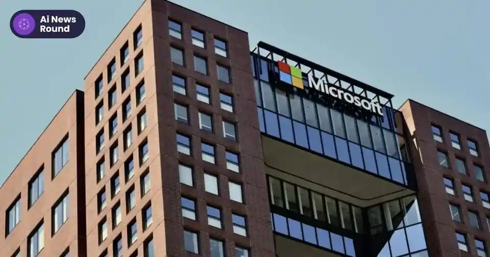 Microsoft office building with the Microsoft sign against a blue sky, with the round Ai News Round logo at top left